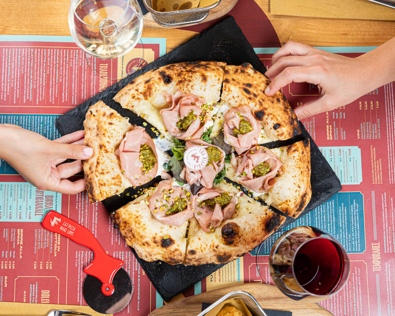 Neapolitan white pizza with mortadella and pistachio